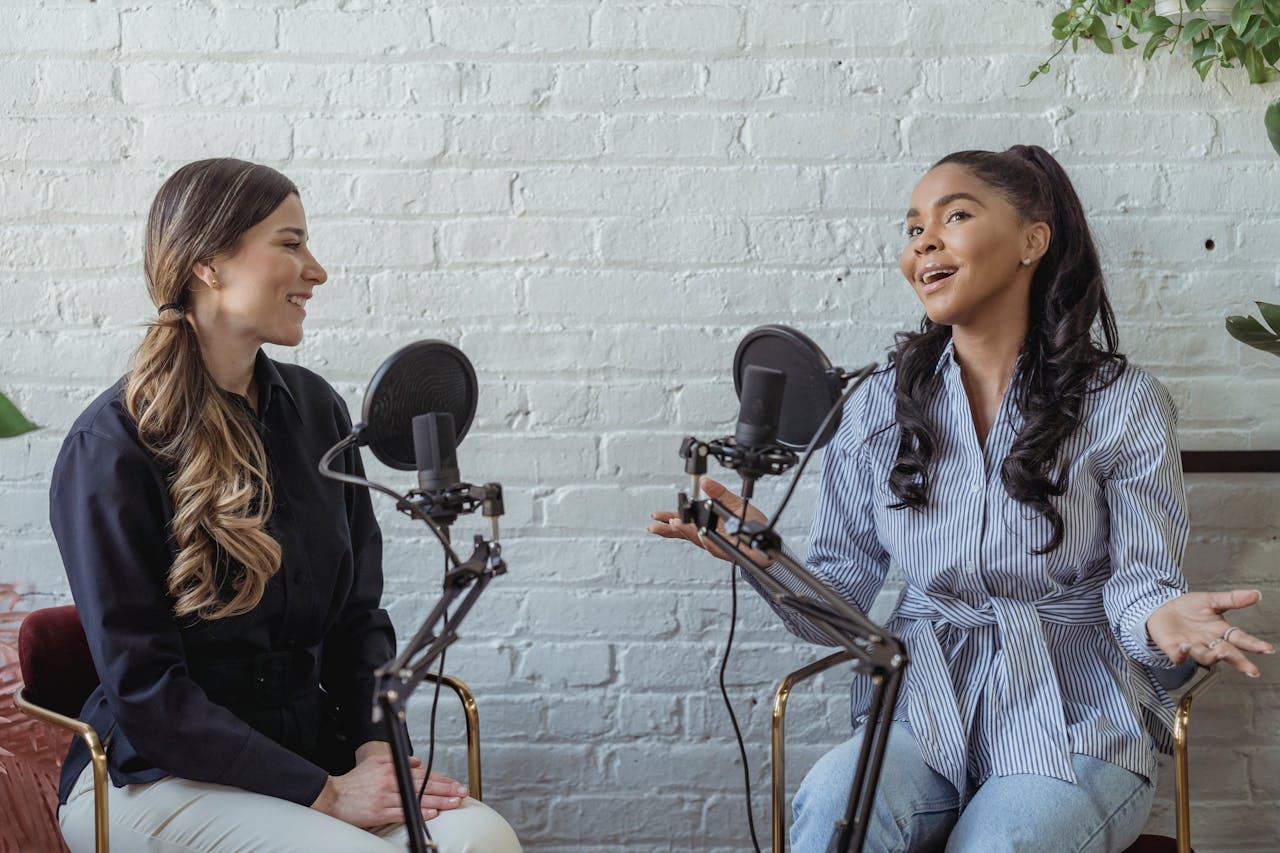 Two people recording a podcast interview